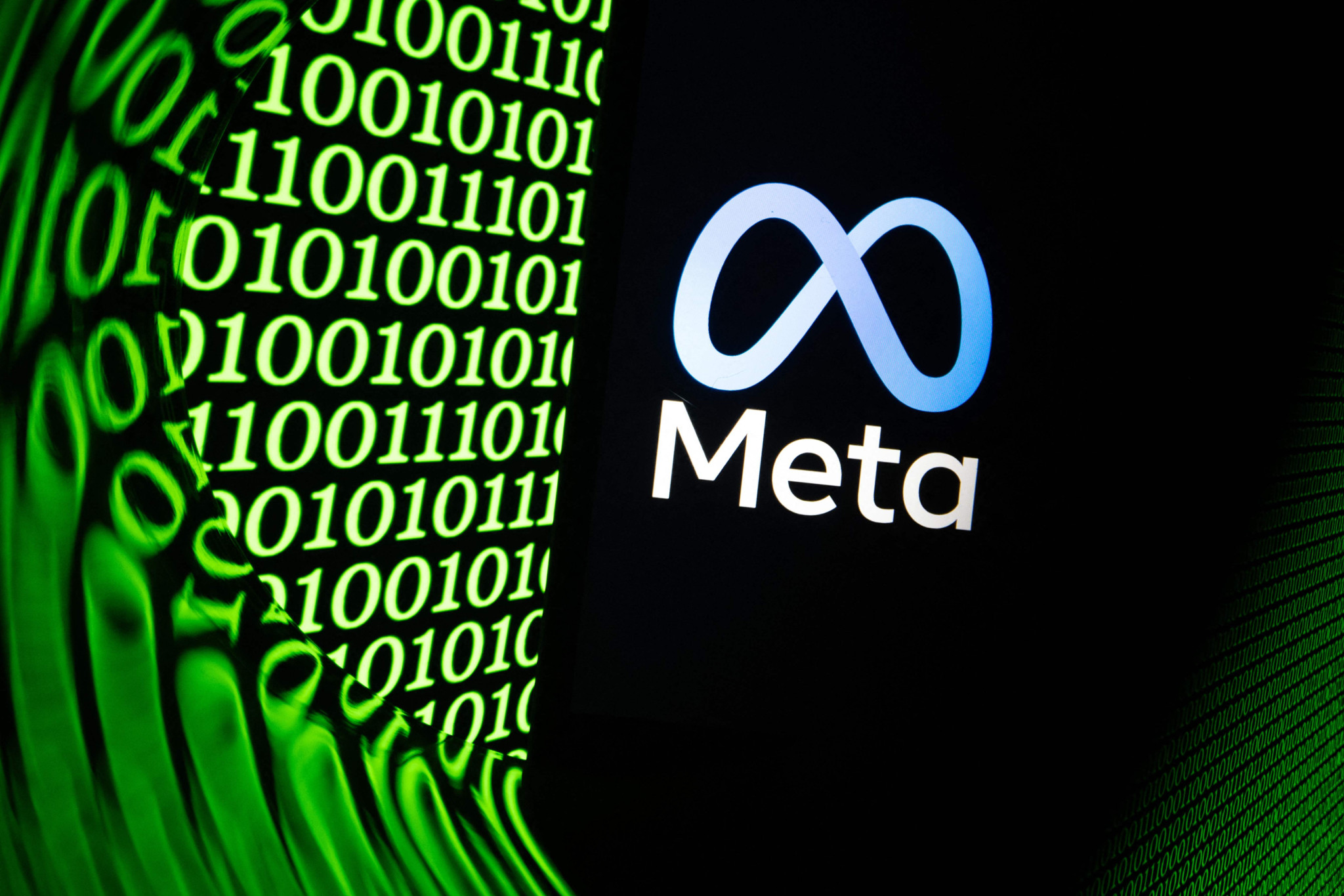(FILES) This illustration photograph shows the logo of the US multinational technology company Meta displayed on a smartphone in Mulhouse, eastern France, on February 11, 2026. A judge of the US state of New Mexico on August 5, 2026, ordered Meta to pay more than half a billion dollars over five years, ruling in favor of the state's claims that the social media giant created a "public nuisance" and harmed children. Meta was previously ordered to pay $375 million in damages to New Mexico in March 2026 when a jury found the company liable for endangering children by making them vulnerable to predators on its platforms, among other harms. (Photo by SEBASTIEN BOZON / AFP)